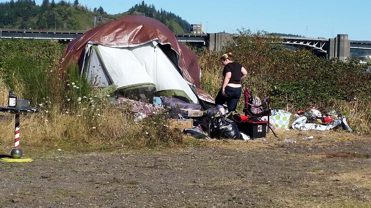 Terri Harber/Daily World Homeless people camping along the Chehalis River in Aberdeen were told by property owner Michael Lang to start packing up and moving along on Monday.