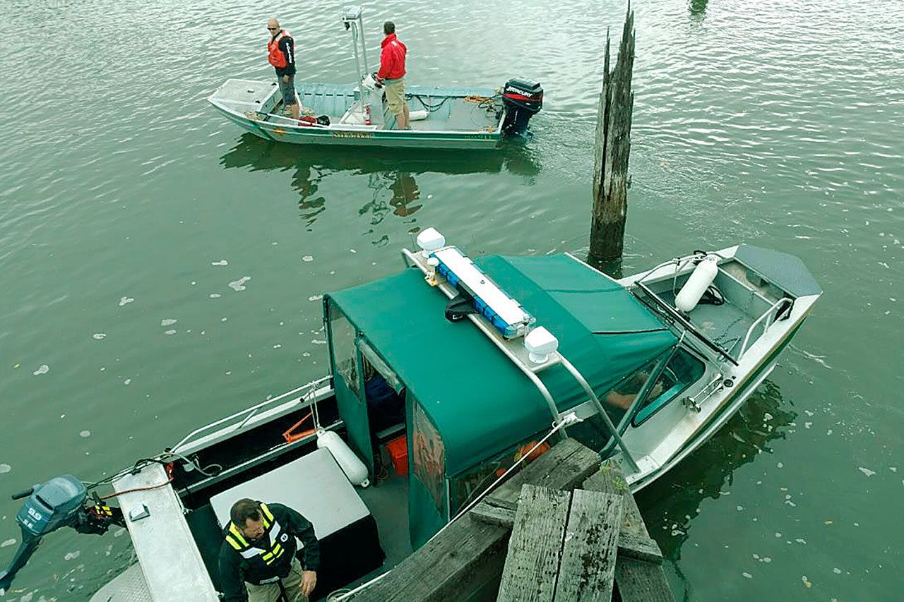 Personnel in two marine patrol boats from Grays Harbor County Sheriff’s Office help search for a man who jumped in the river near the Little Hoquiam Shipyard Wednesday morning Sept. 14. COURTESY PHOTO/GRAYS HARBOR SHERIFF’s OFFICE