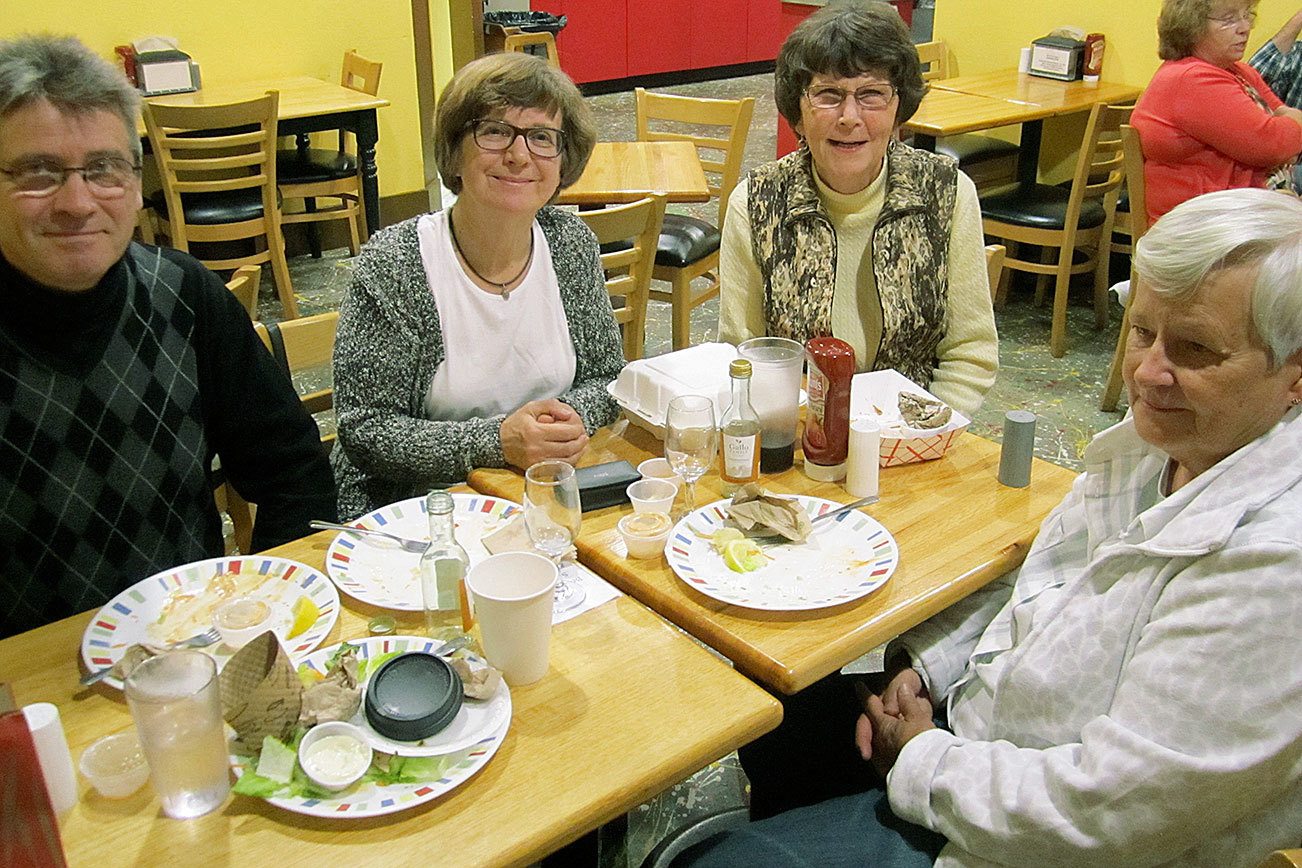 From left are Lasse Koskelainen, Liisa Raitinpaa, Bonnie Johannes (Grays Harbor Genealogical Society), and Marja Salmiluoto. The four met at the Breakwater to discuss Raitinpaa family history in Grays Harbor County. (Courtesy photo).