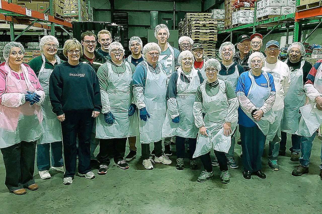 Coastal Harvest Volunteers help with the repackaging of bulk frozen foods into family size portions for distribution to food banks in seven southwest Washington counties. (Deb Blecha/courtesy photo)