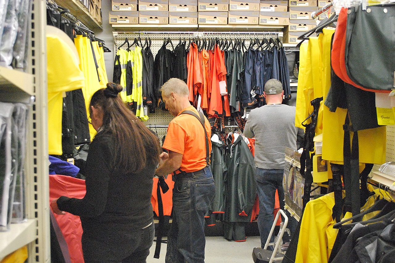 Locals were purchasing rain gear at the Dennis Company Wednesday in anticipation of what some forecasters are saying could be the biggest weather system to hit the Twin Harbors since the 62’ Columbus Day storm. (BOB KIRKPATRICK|THE DAILY WORLD)