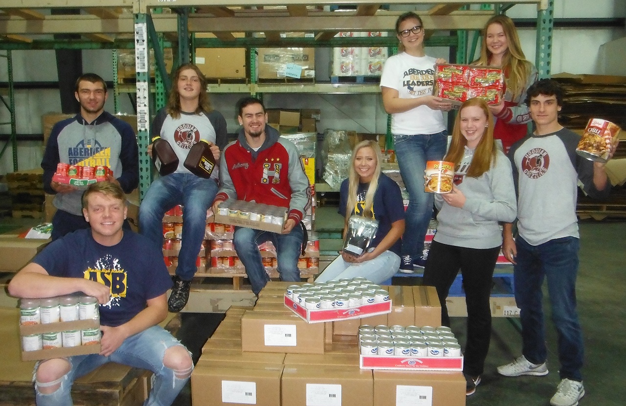 Members of the 2016 Food Ball teams are gearing up for their annual food drive competition benefitting Coastal Harvest. Pictured back row, left to right, are Braden Castleberry-Taylor (AHS), Loghan Hurley (HHS), Anthony Nash (HHS), Haley Farrer (AHS), Bailey Harper (AHS) and Paige Folkers (HHS). Front row, left to right, are Jake Metke (AHS) and Hoquiam students Jessica Goulet and Sean McAllister. (DAN HAMMOCK|THE DAILY WORLD)