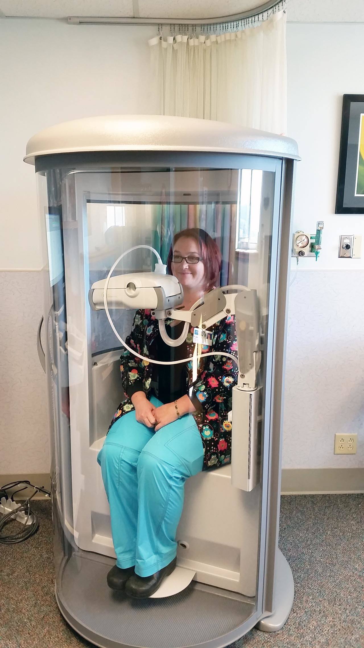 Terri Harber/The Daily World Valerie Norwood, the cardiopulmonary supervisor at Grays Harbor Community Hospital, sits inside the hospital’s new diagnostic body plethysmograph used for lung testing.