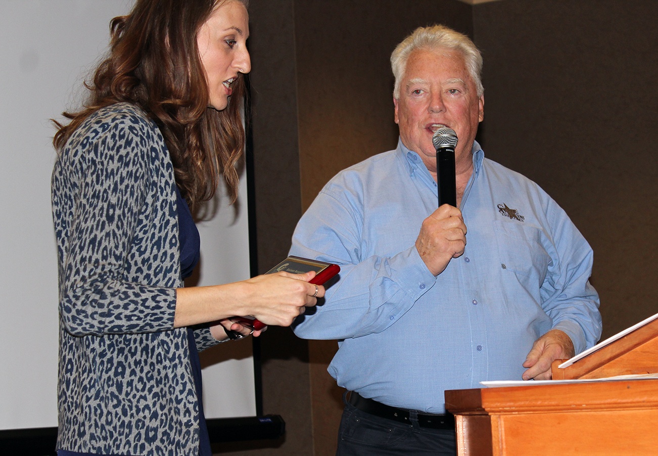 Angelo Bruscas/North Coast News: Lisa Smith presents the New Business of the Year award to Extreme Fun Center owner John Schweiger.