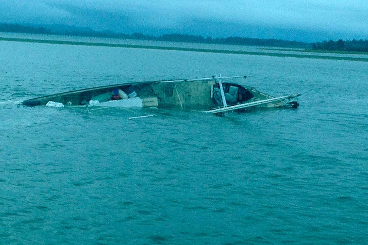 The Pacific Rim fishing vessel hit submerged rocks at Pt. Chehalis early Sunday morning, rolled onto its side, and drifted into South Bay. (Photo by Petty Officer 2nd Class Robert Beresh)