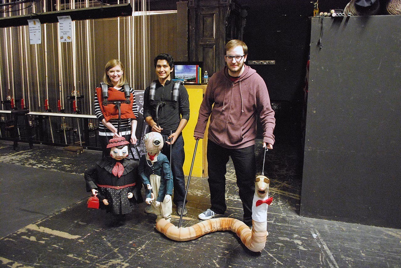 Actors Sarah Hadley, Carlos Cruz, Adam Cooper show some of the puppets to be featured in the upcoming production of “James and the Giant Peach” next month at the Bishop Center for Performing Arts at Grays Harbor College. (Terri Harber|The Daily World)