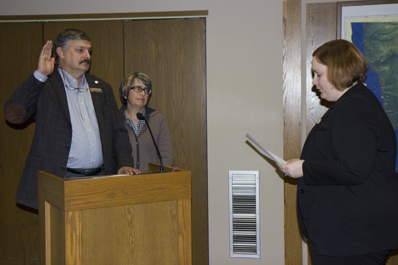 (Corey Morris | The Vidette) Ken Albert of Montesano is sworn in as county treasurer on Nov. 7 with his wife, Donna, by his side. County Prosecutor Katie Svoboda led Albert in his oath of office.