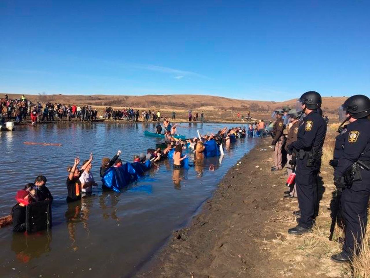 Police from six states have been marshalled by the state of North Dakota to attempt to shut down protests against the Dakota Access Pipeline by tribal members from across the country and their supporters. The pipeline is planned to cross the Missouri within a half mile of the Standing Rock Sioux reservation. The developer of the $3.8 billion pipeline is Energy Transfer Partners of Dallas (Morton County Sheriff’s Office/TNS)