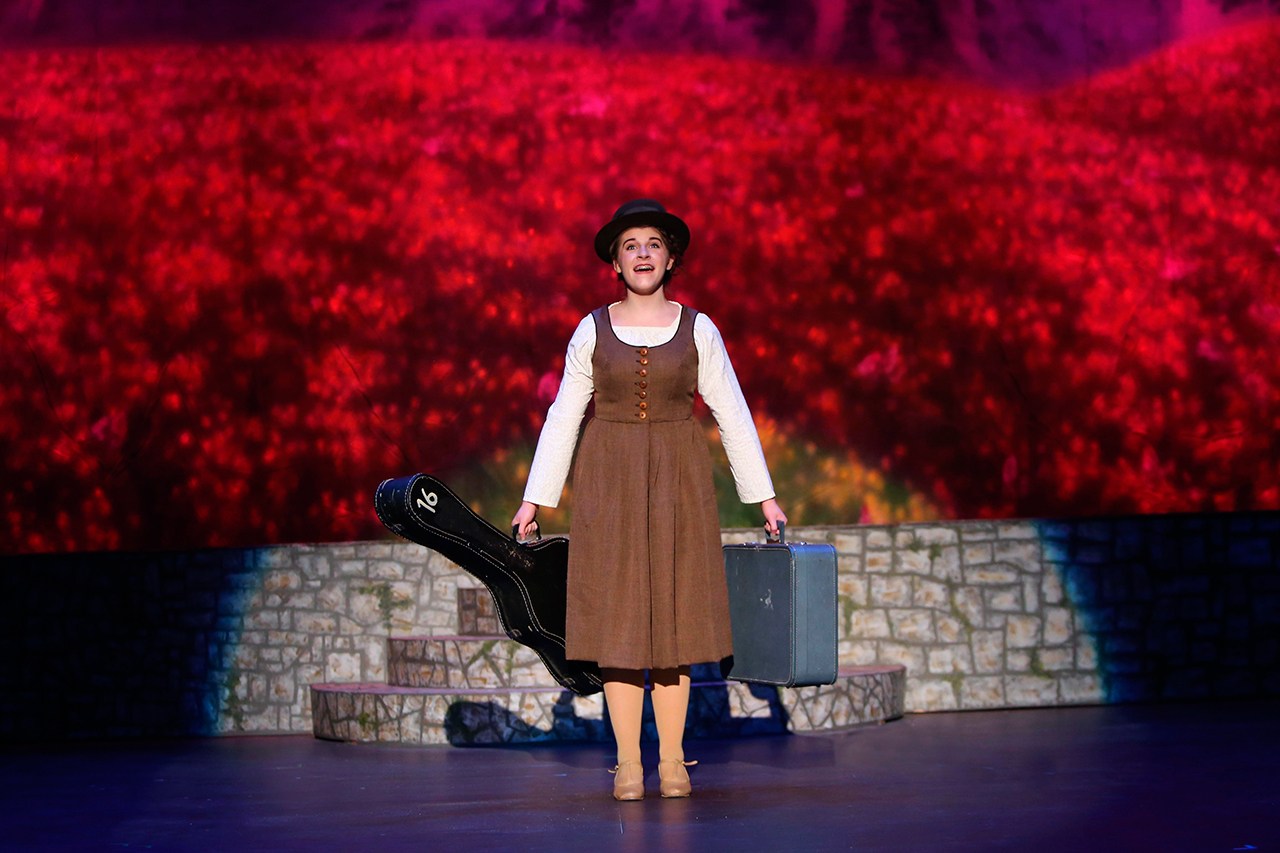 The abbey postulant Maria Ranier (Kendall Cavin) sings how “the hills are alive with the sound of music” as she heads to her first assignment at the von Trapp residence. (Photo by Keith Krueger)