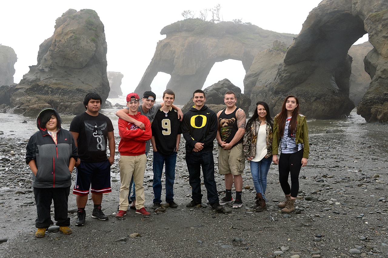 The Taholah class of 2015 poses in front of Elephant Rock in May 2015. This was a popular place for photos. Photo by Larry Workman