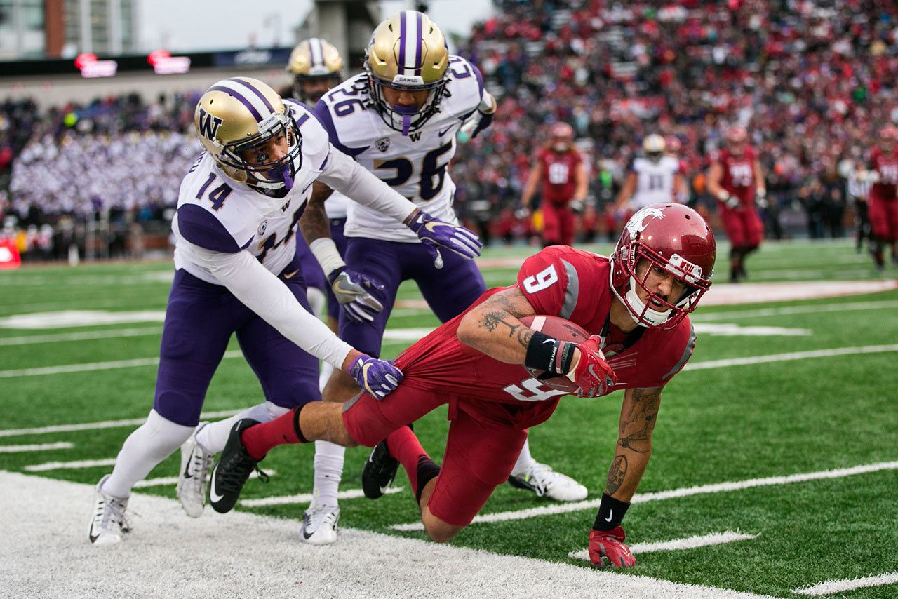 Johnny Andrews | Seattle Times                                WSU wide receiver Gabe Marks, seen here with a reception against Washington in the 109th Apple Cup in November, will get another chance for redemption when the Cougars will take on Minnesota in the Holiday Bowl in San Diego.