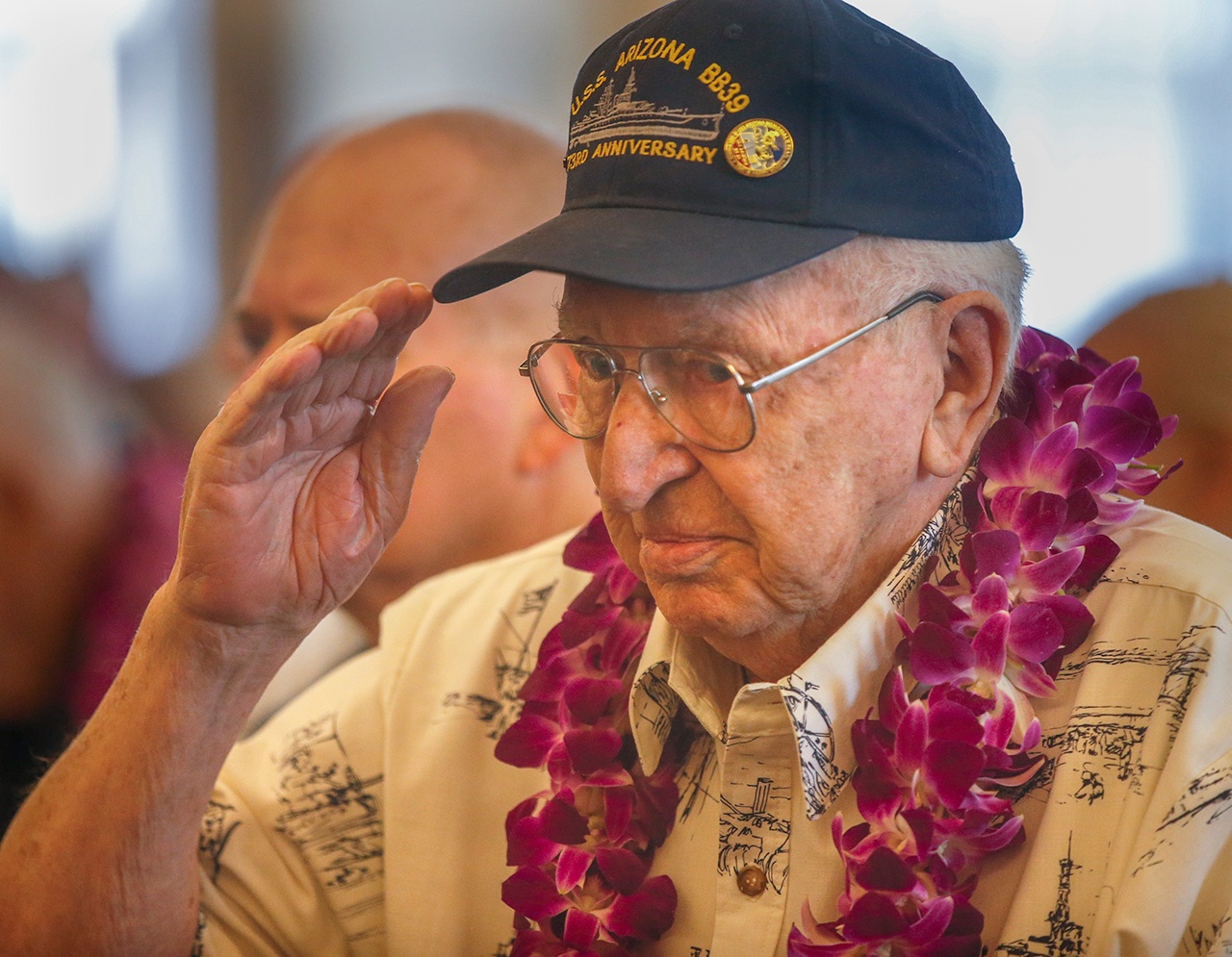 Pearl Harbor survivor Lauren F. Bruner, who still mourns his lost shipmates from the USS Arizona, salutes the flag during the presentation of the colors during a ceremony in Newport Beach, Calif., honoring eleven of the survivors as the 75th anniversary of the attack approaches, on October 26, 2016. (Mark Boster/Los Angeles Times)