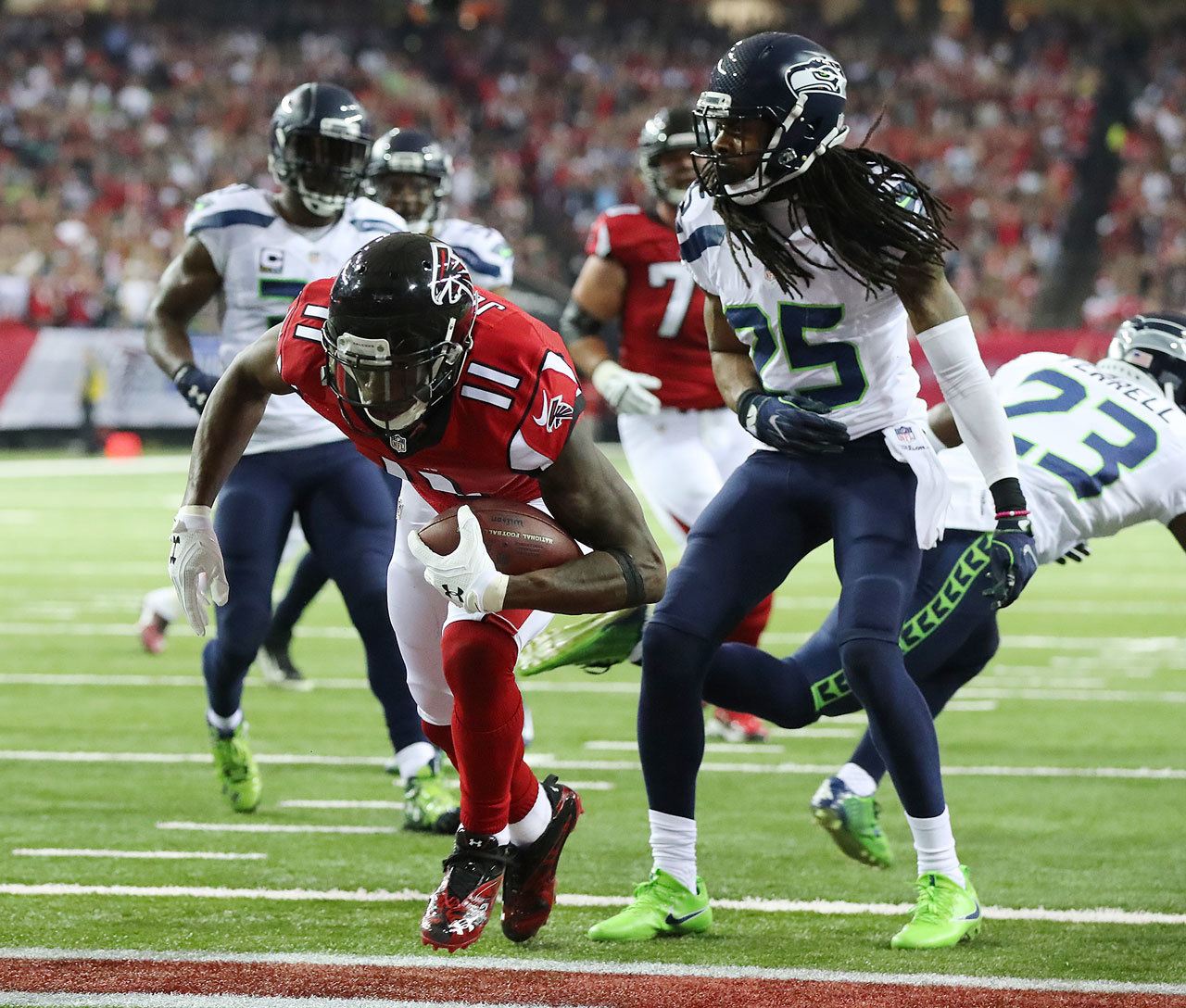 (Curtis Compton/Atlanta Journal-Constitution) Seattle’s Richard Sherman, seen here during last Saturday’s NFC Divisional Playoff game in Atlanta, apparently had a knee injury for the second half of the season. The NFL is investigating the Seahawks about whether the team intentionally hid the injury from the injury reports.