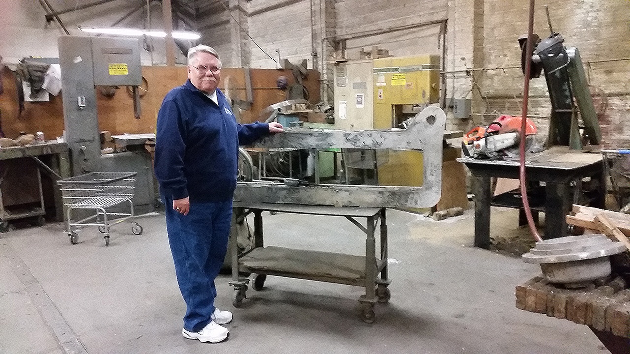 Bill Newman stands next to one of the larger castings created at the Bergstrom Foundry in Aberdeen. He retired last week. (Terri Harber|The Daily World)