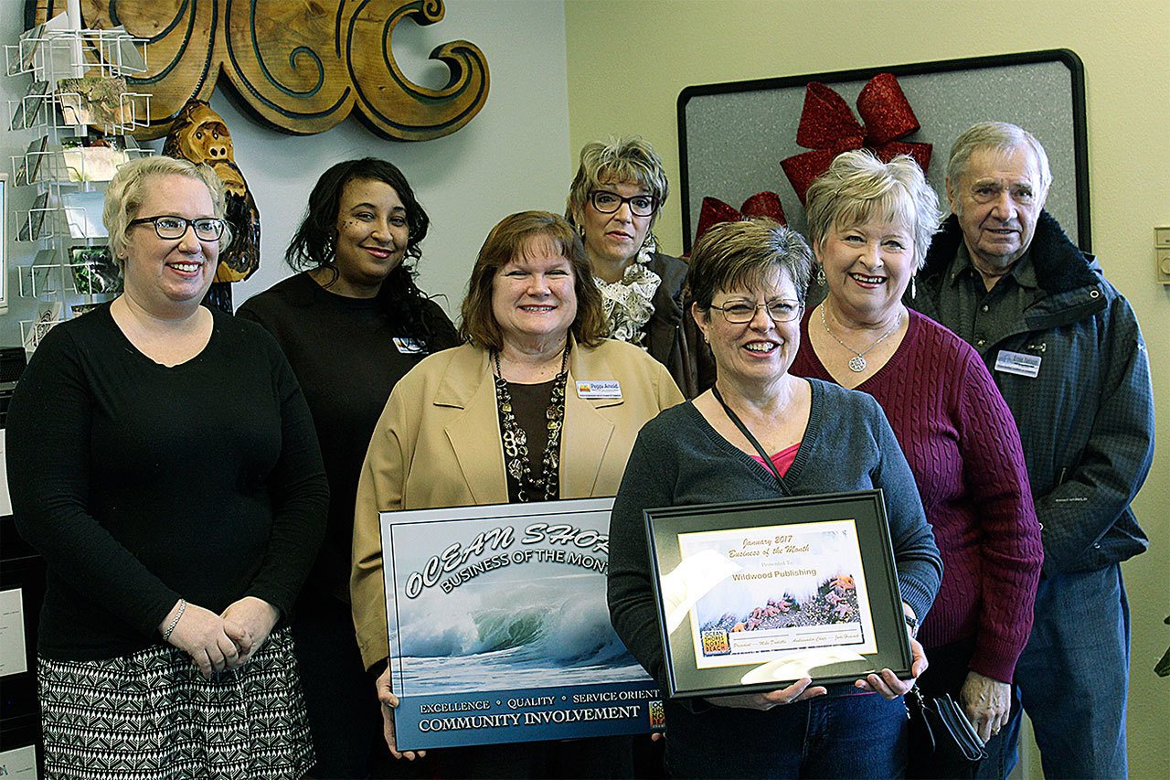 (NORTH COAST NEWS) New Ocean Shores/North Beach Chamber Director Piper Leslie, far left, joins the Ocean Shore/North Beach Chamber Ambassadors in presenting the Business of the Month award to Marlene Thomasson and the Ocean Shores Observer.