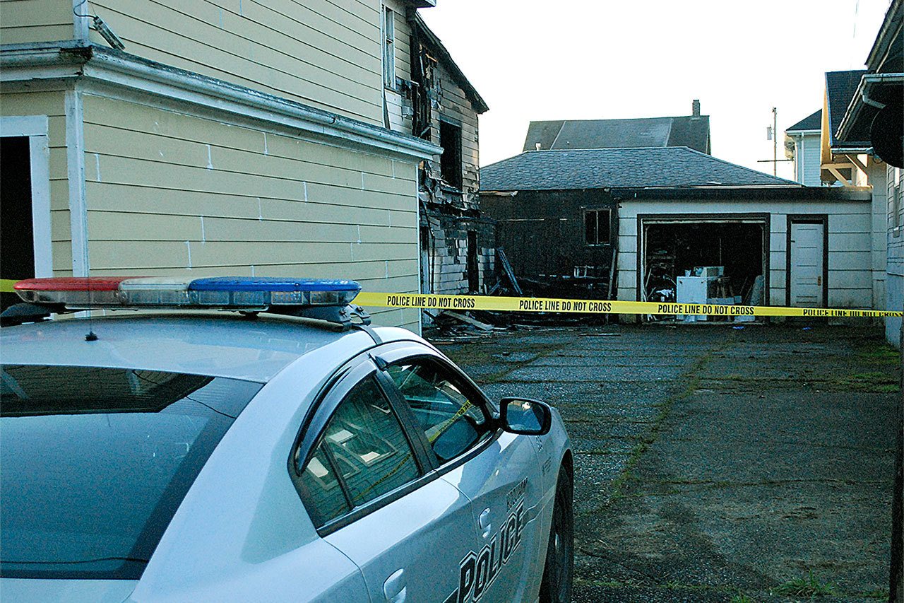 The rear section of a vacant apartment building in the 600 block of Eklund Street in Hoquiam caught fire around 9:30 Thursday night. The blaze spread to a couple of garages on the property. Homes on either side of the apartment building escaped major damage. (BOB KIRKPATRICK|THE DAILY WORLD)