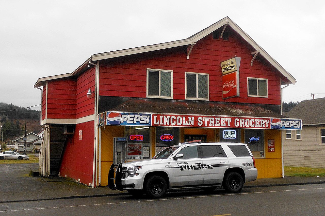 A man armed with a gun robbed the Lincoln Street Grocery Monday morning. The gunman fled north, prompting a lockdown of nearby Lincoln Elementary School. Hoquiam Police responded in force and, with the aid of a department K9, flooded the area in search of the suspect, described as a white male, six feet tall with light colored eyes. He was wearing a full plastic facemask and made off with about $160.                                (DAN HAMMOCK THE DAILY WORLD)