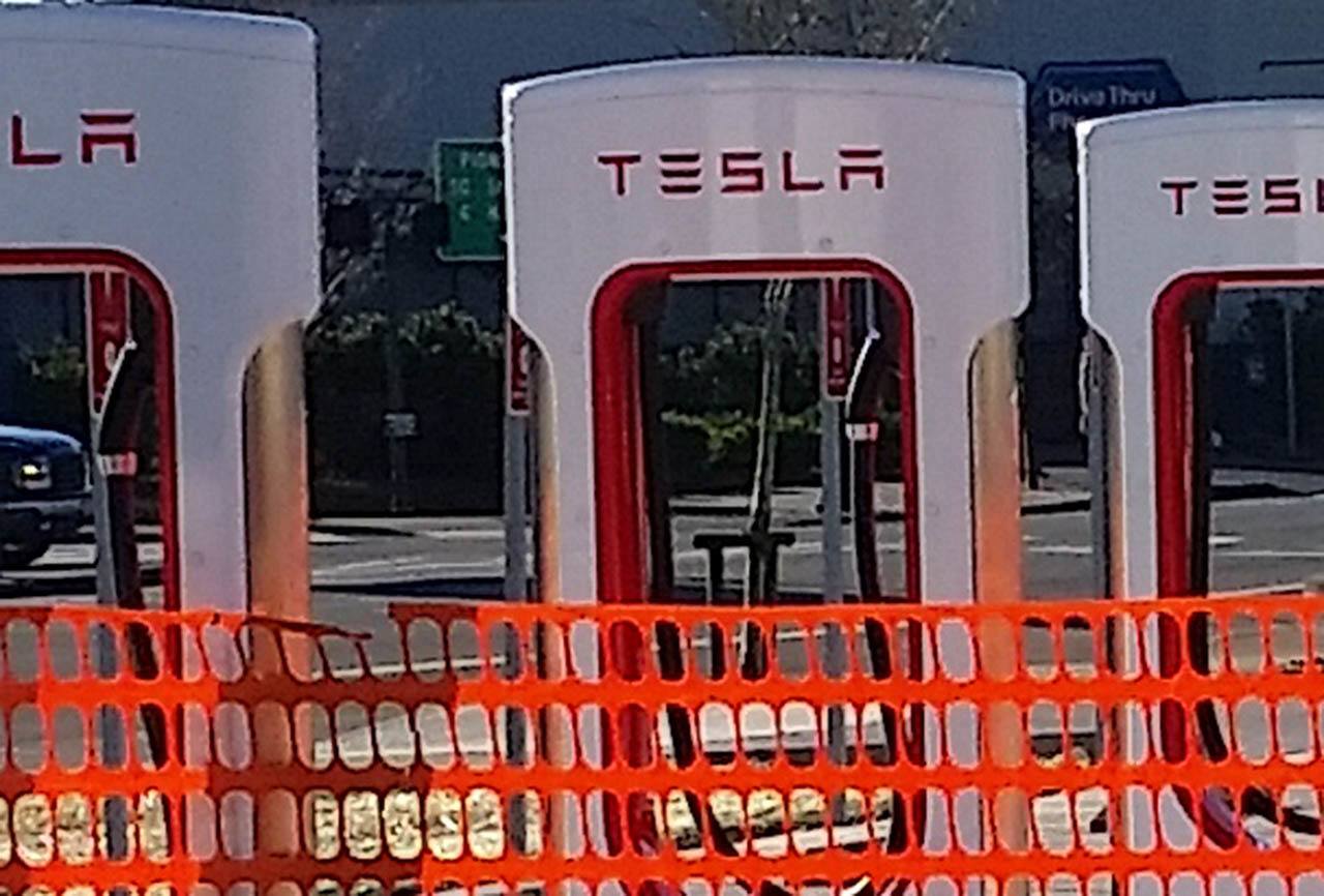 Chargers at the Tesla Supercharger station in downtown Aberdeen. Mayor Erik Larson is fining himself $500 and intends to void the city’s contract with Tesla Motors after violating state code during the process of forming the agreement. He denies doing so for personal gain. (Terri Harber|The Daily World)