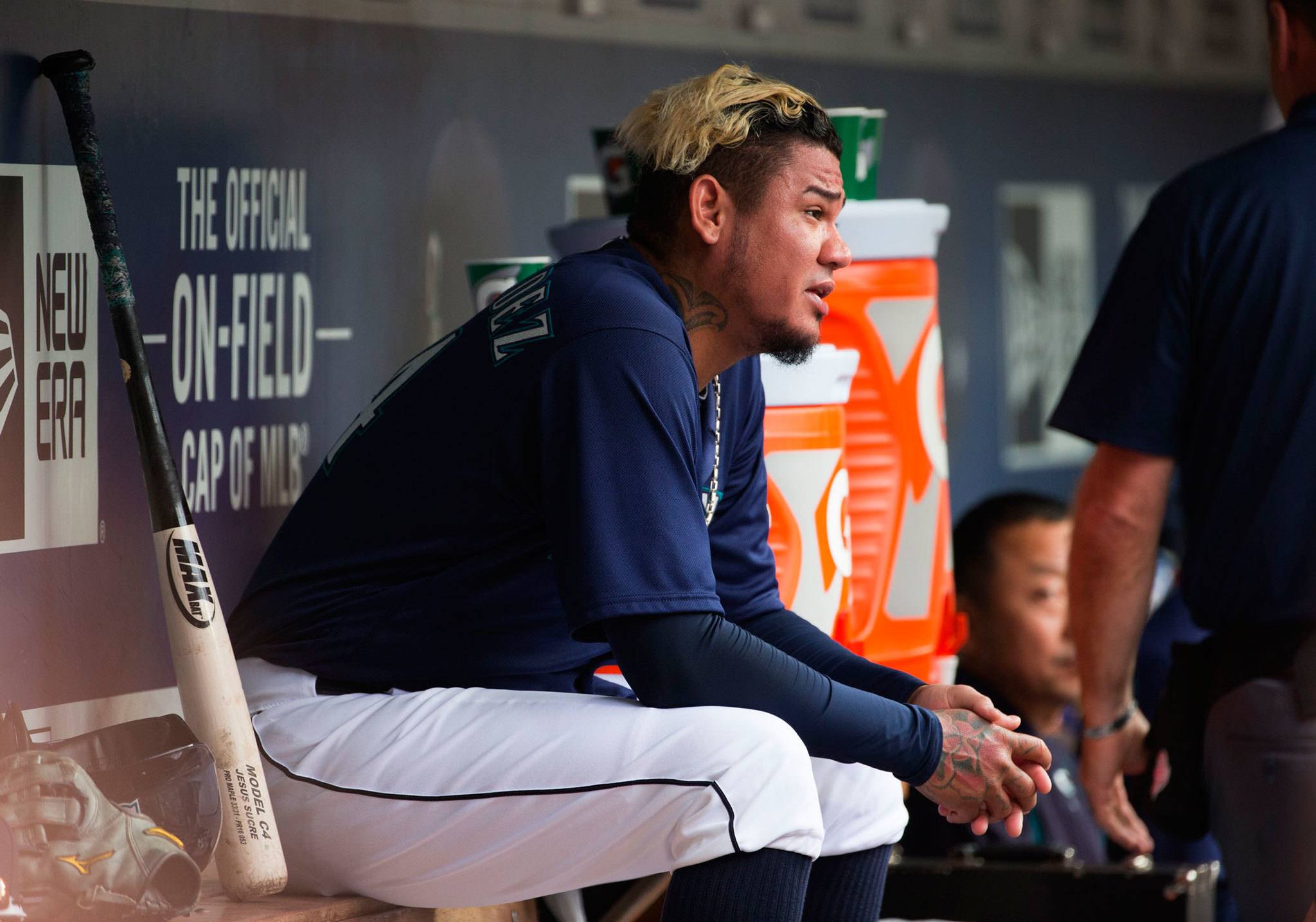 (Lindsey Wasson | The Seattle Times) Seattle Mariners starting pitcher Felix Hernandez sits in the dugout after a game last season at Safeco Field. Hernandez is eager to prove his critics wrong that his health is good and his game is just as strong as in years’ past.