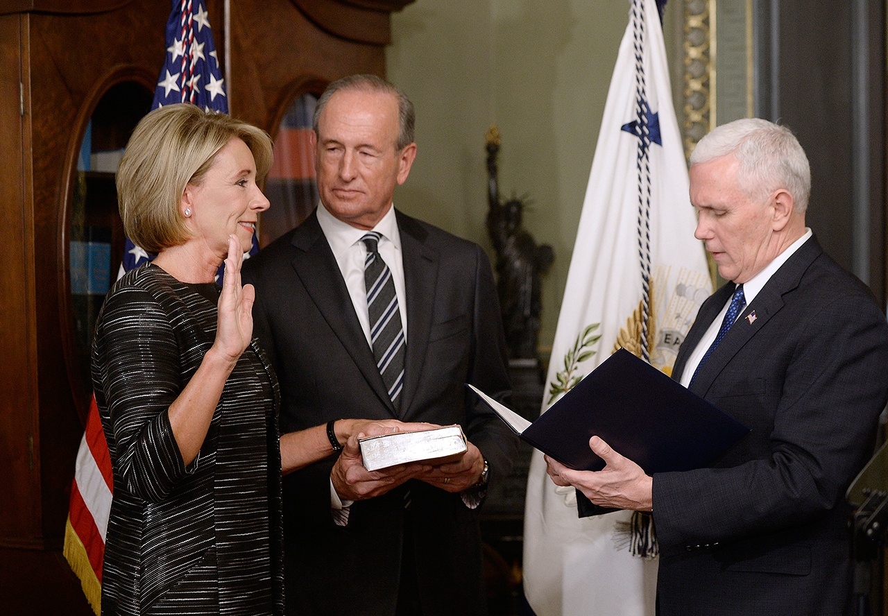 Vice Presdient Mike Pence swears in Betsy DeVos as the Education Secretary in the Vice President’s Ceremonial Office of the White House on Tuesday in Washington, D.C. (Olivier Douliery/Abaca Press)