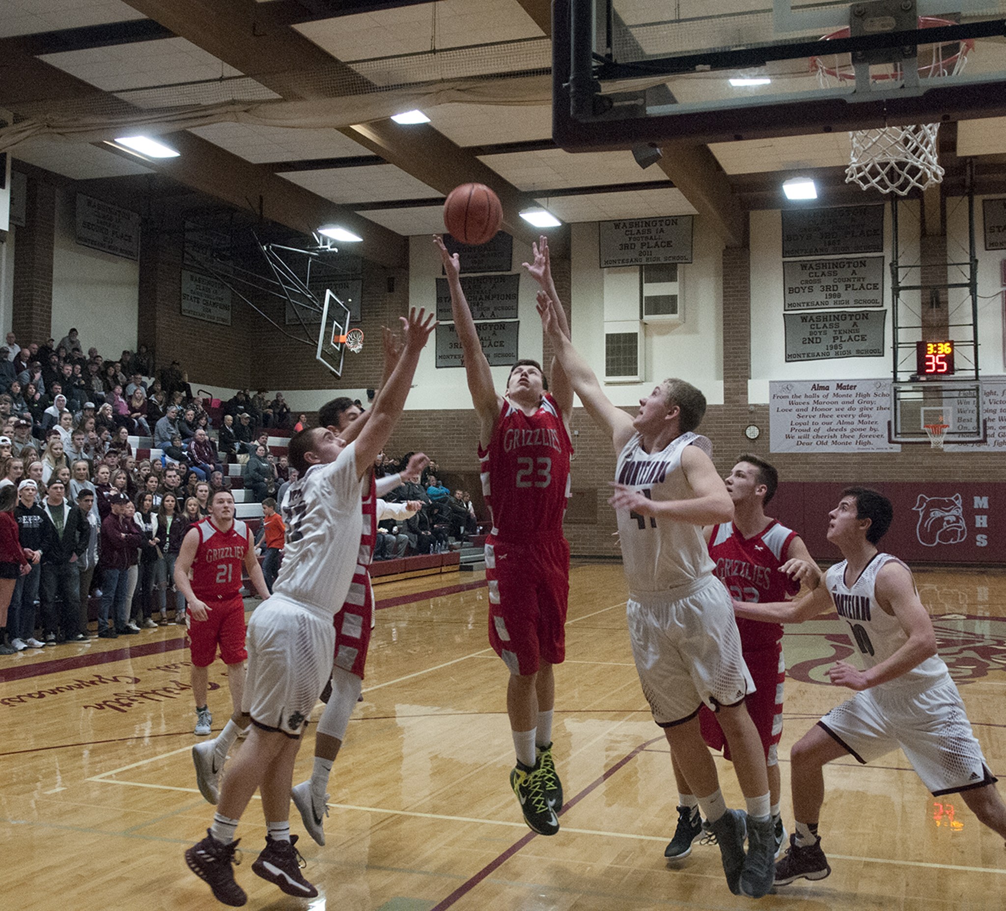 (Brendan Carl | The Daily World) Hoquiam’s Jack Adams III goes up for a rebound between Montesano’s Seth Dierkop (41) and LJ Valley (32) during an Evergreen 1A League game at Bo Griffith Gym on Thursday.
