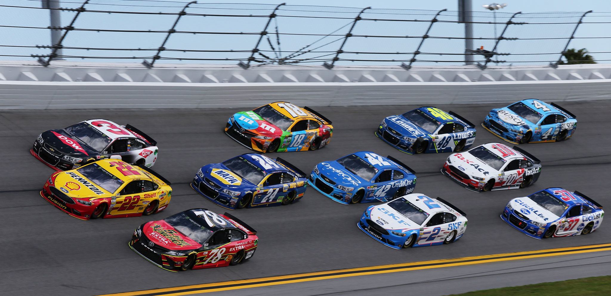 (Jerry Markland | NASCAR Media) Martin Truex Jr. (78), Joey Logano (22) and Austin Dillon (3) lead a pack of cars during the weather delayed Monster Energy NASCAR Cup Series Advance Auto Parts Clash at Daytona International Speedway on Sunday.