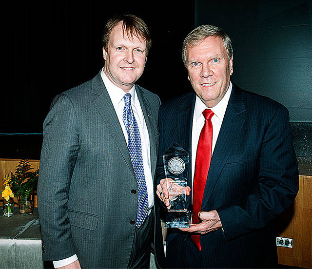 Michael Hansen receives his award from Elliot Mainzer, Bonneville Power Administrator.