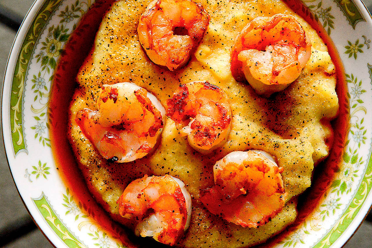 Top pan-seared shrimp with a slightly sweet sherry vinegar-shallot sauce before serving them with Parmesan polenta. (Photo by Lake Fong/Pittsburgh Post-Gazette)
