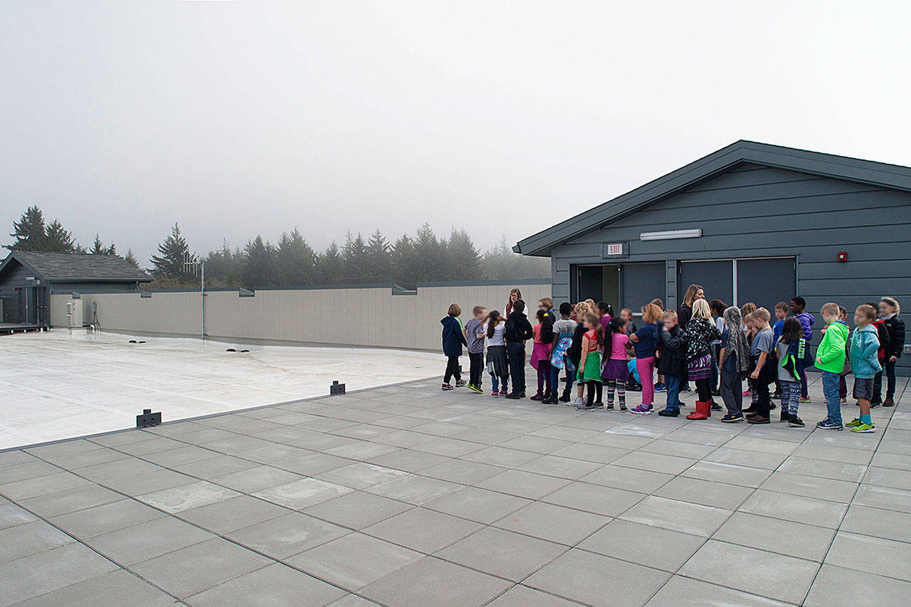 PETE ECKERT ECKERT & ECKERT PHOTOGRAPHY                                Ocosta Elementary School students line up as part of a tsunami drill at the school’s evacuation platform. A community-wide tsunami drill will take place Saturday at 11 a.m.
