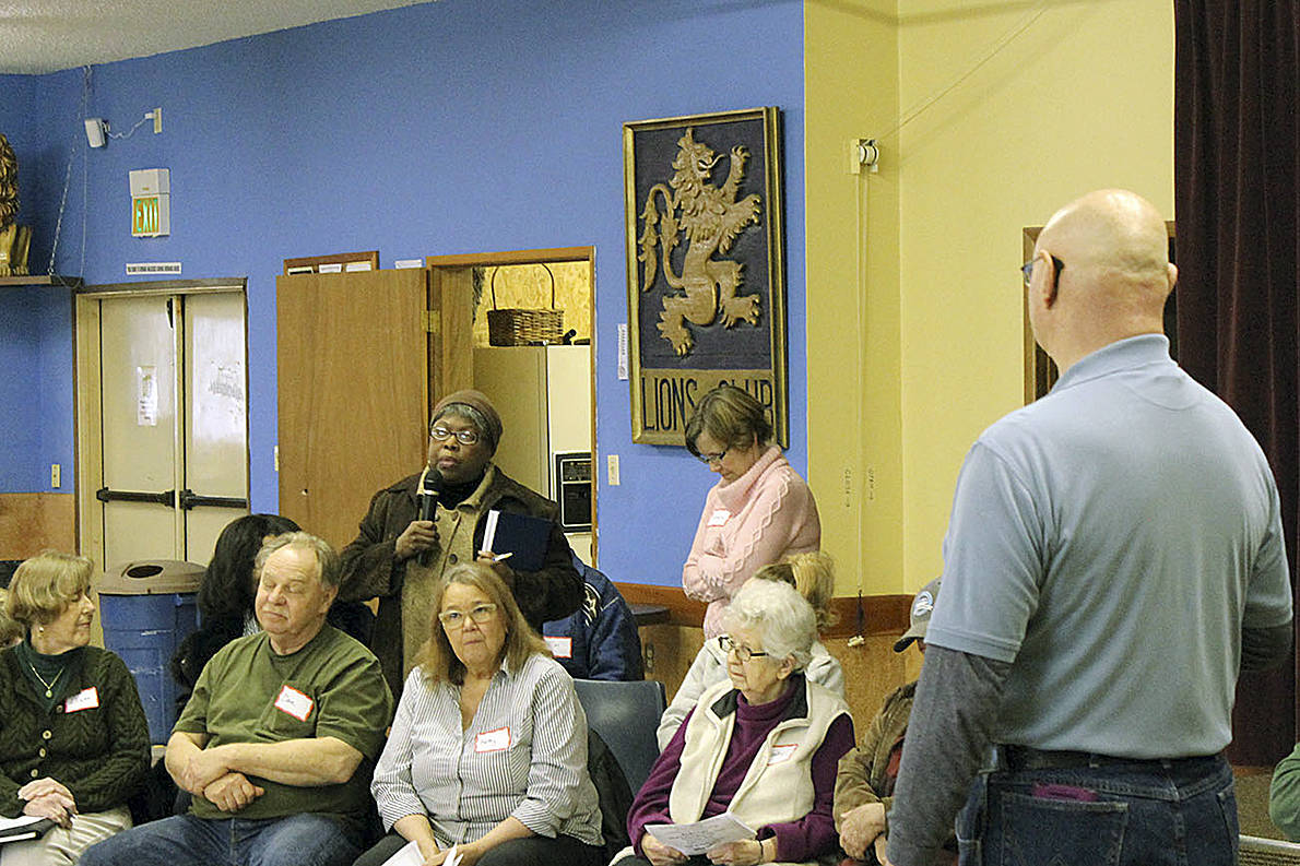 ANGELO BRUSCAS|NORTH COAST NEWS                                Doreen Cato asks a question with Richard Wills, standing, as one of the moderators during a Town Hall on March 26 at the Ocean Shores Lions Club.