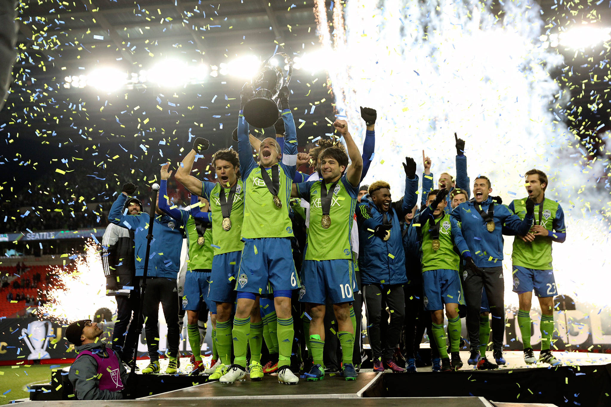 (Dan Poss | Seattle Sounders FC Communications) The Seattle Sounders FC squad celebrates winning the 2016 MLS Cup in Toronto after knocking off Toronto FC in a penalty kick shootout. Now, the Sounders will aim to repeat their trophy winning season, but will use the opening games to get healthy after a short offseason.