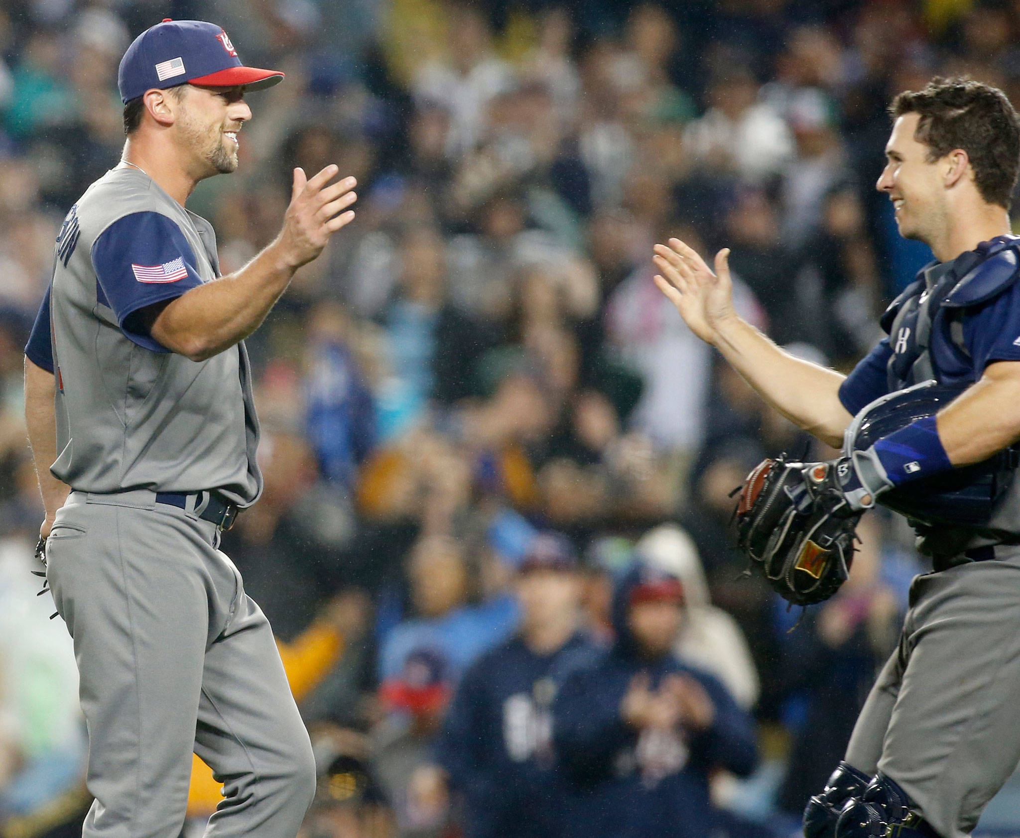 (Allen J. Schaben/Los Angeles Times) United States relief pitcher Luke Gregerson, left, celebrates with catcher Buster Posey after striking out Japan’s Nobuhiro Matsuda for the final out in the World Baseball Classic semifinals at Dodger Stadium in Los Angeles on Tuesday. The U.S. advanced, 2-1.