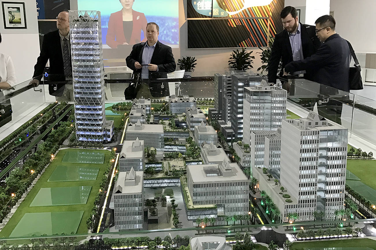 GREATER GRAYS HARBOR PHOTO                                Greater Grays Harbor CEO Dru Garson and Aberdeen Mayor Erik Larson check out a development model during their trip to Shenzhen, China last month.