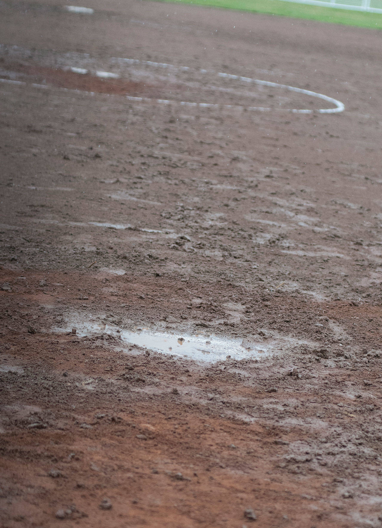 (BRENDAN CARL | THE DAILY WORLD) Record rainfall in March have turned baseball and softball fields into muddy, sloppy, slippery surfaces unfit for play. Traditionally, there is less rain in April and fields like this will need the dry weather to drain the water to make them playable.