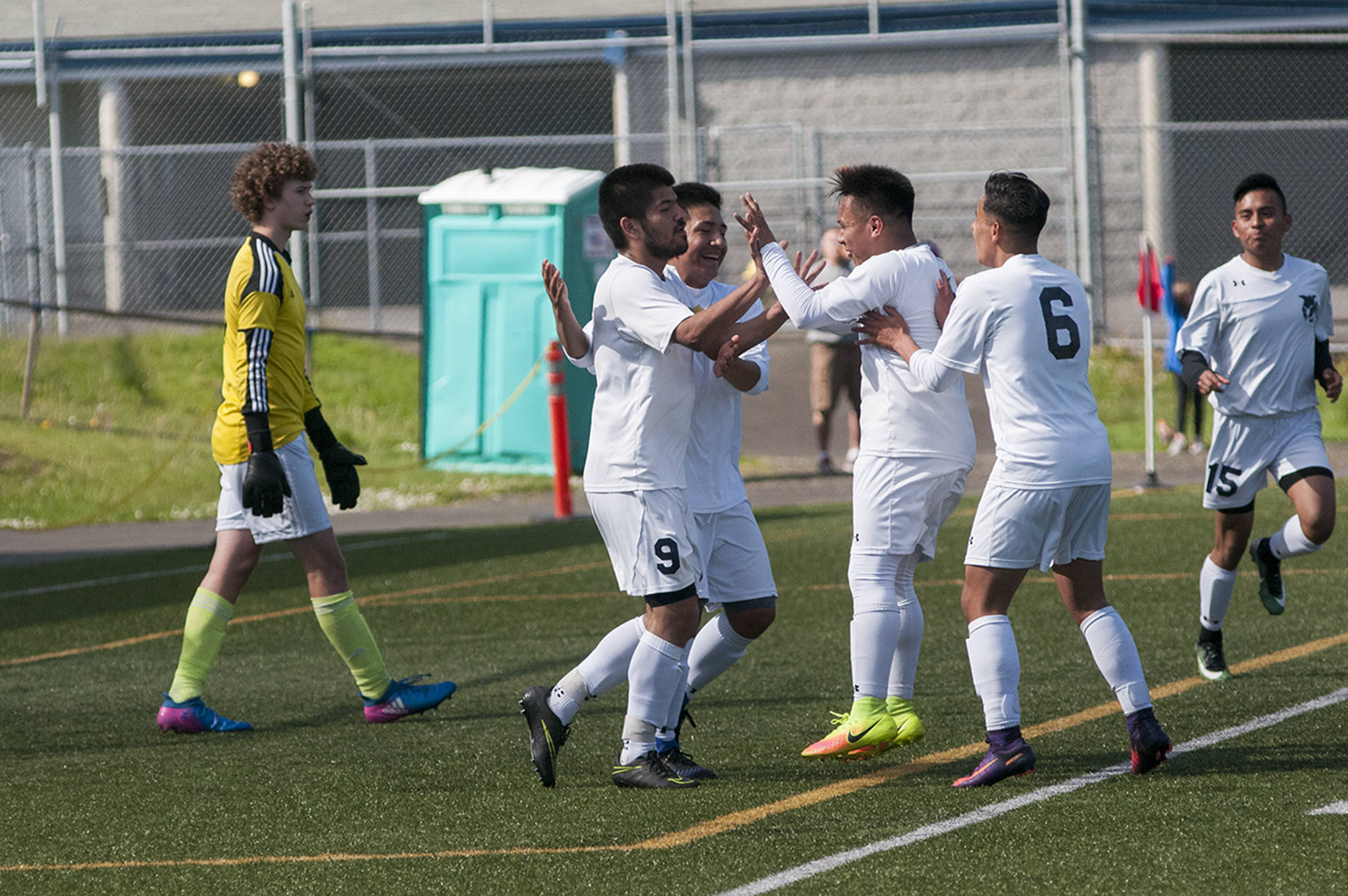 (Brendan Carl | The Daily World) Aberdeen’s Cesar Corona (9) is congratulated by teammates after scoring the game-winning goal against Hockinson on Saturday.