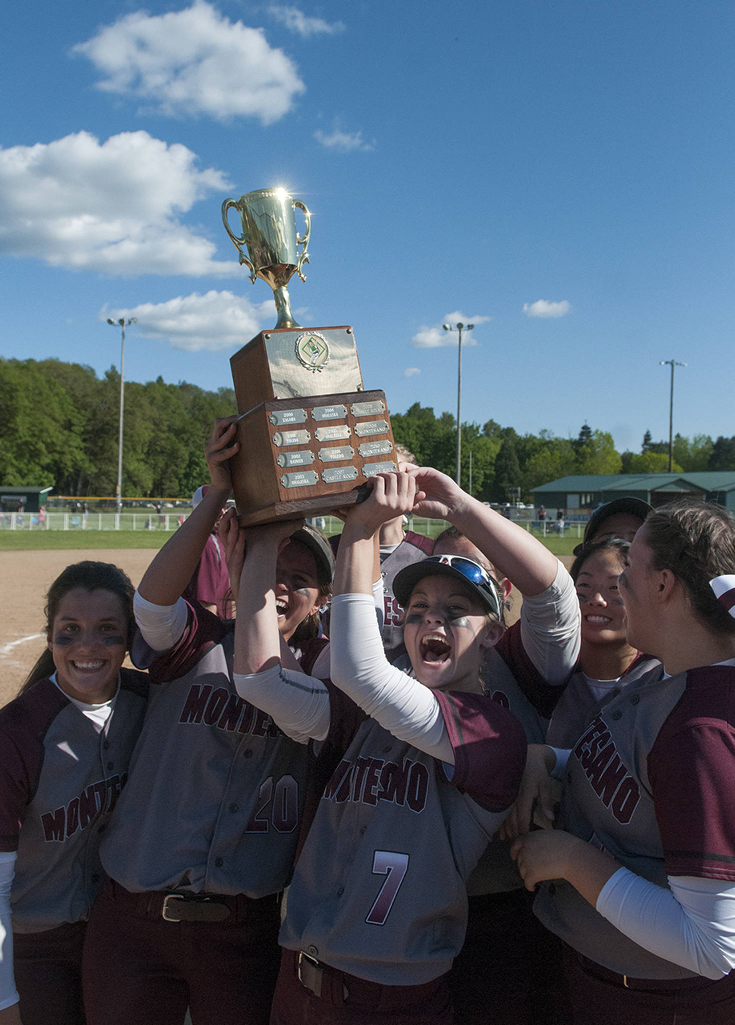 (Brendan Carl | The Daily World) Montesano’s Cheyann Bartlett (7) and Josie Toyra hoist the district title trophy after the Bulldogs defeated La Center 5-0 on Saturday.