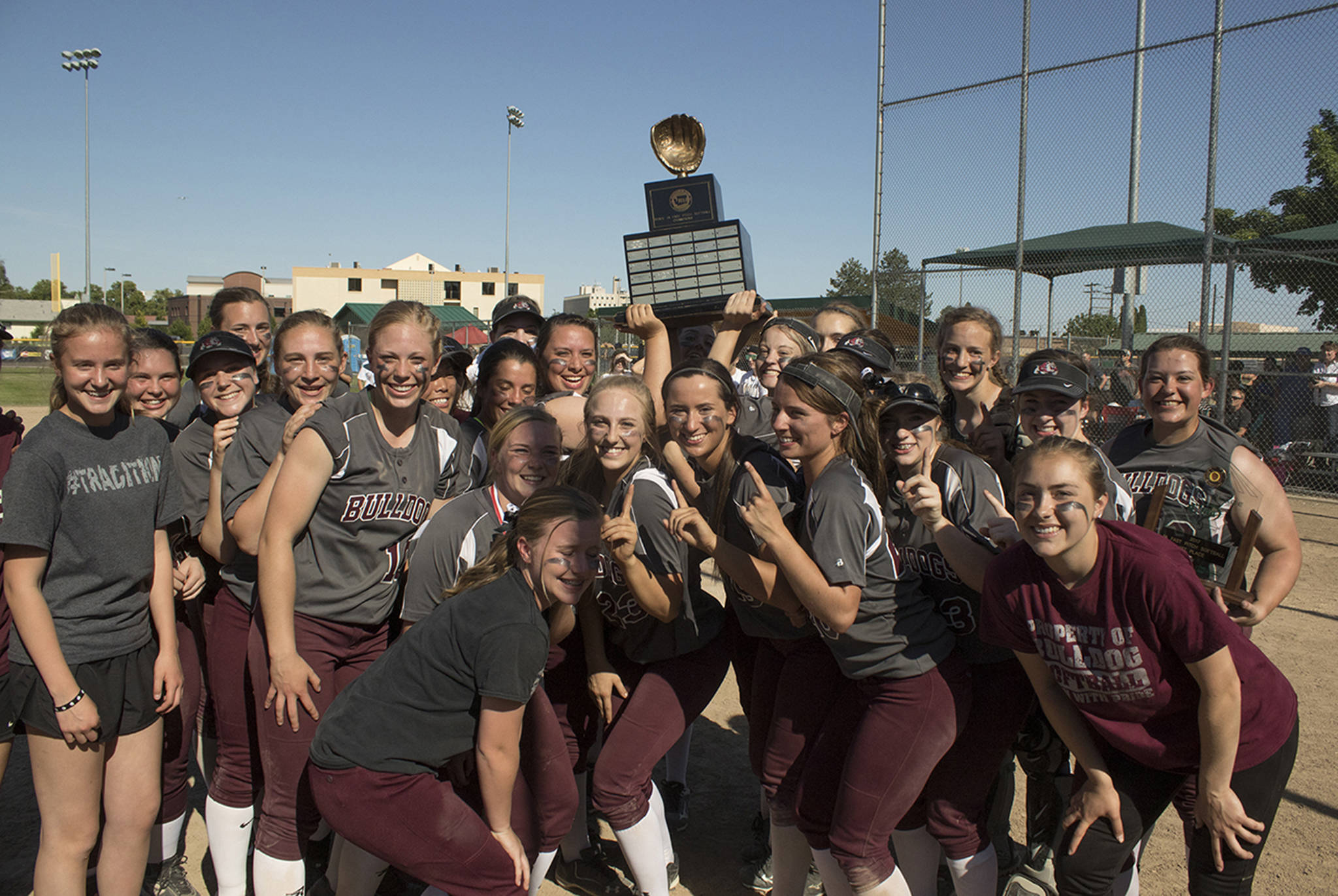 (Brendan Carl | The Daily World) Montesano lifts the state 1A softball title after defeating La Center 8-2 on Saturday.