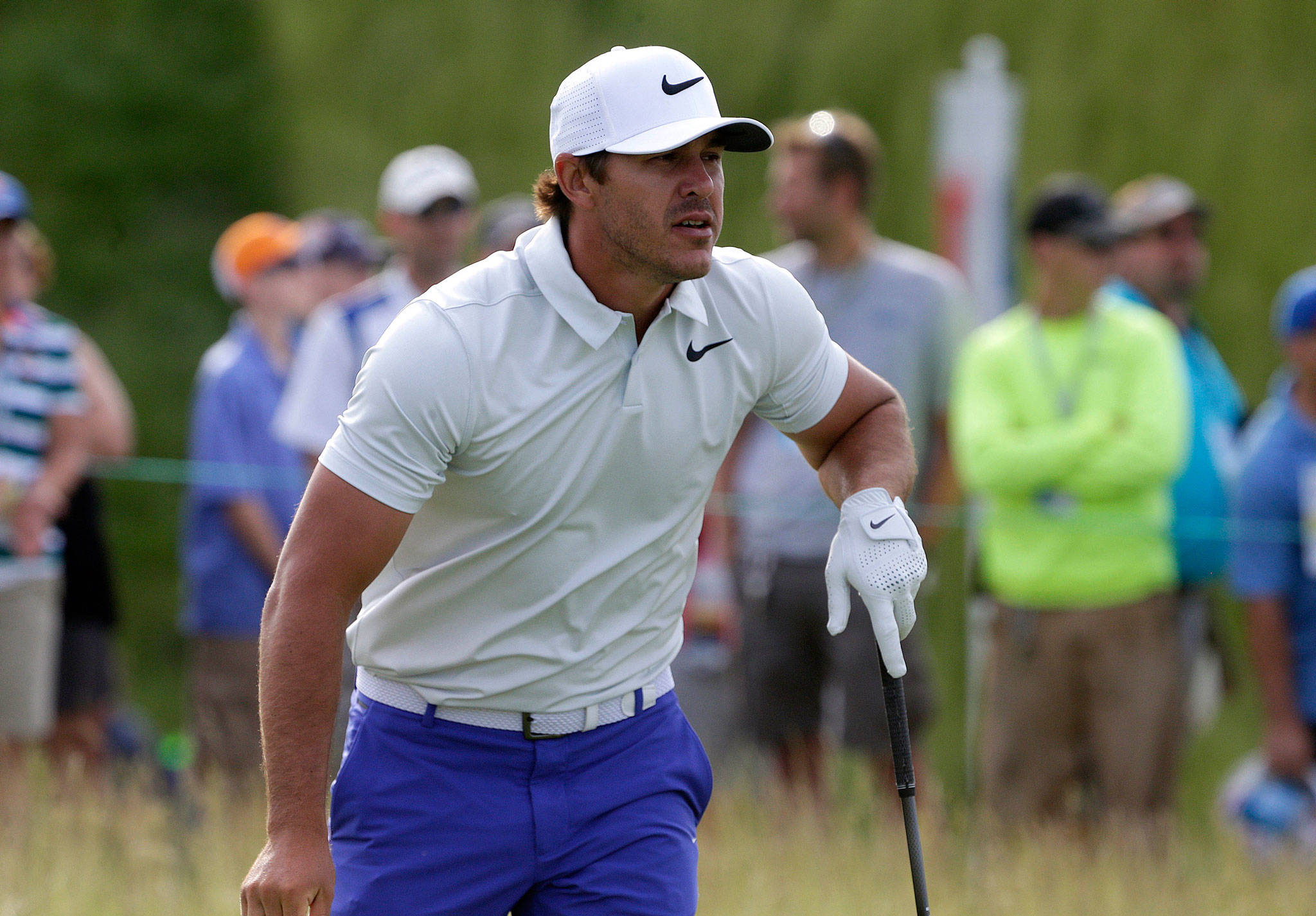 (Rick Wood | Milwaukee Journal Sentinel) Brooks Koepka watches his shot after he tees off on hole No. 1 during the opening round of the 2017 U.S. Open Championship at Erin Hills on Thursday.