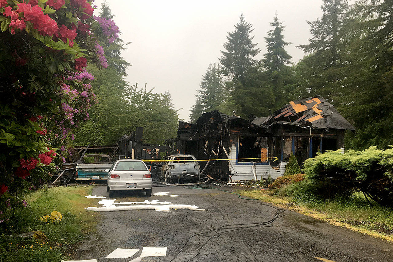 DAN HAMMOCK | THE DAILY WORLD                                The fire Thursday morning in Central Park destroyed the home, vehicles and possessions of a family of four. The cause of the fire is still under investigation.
