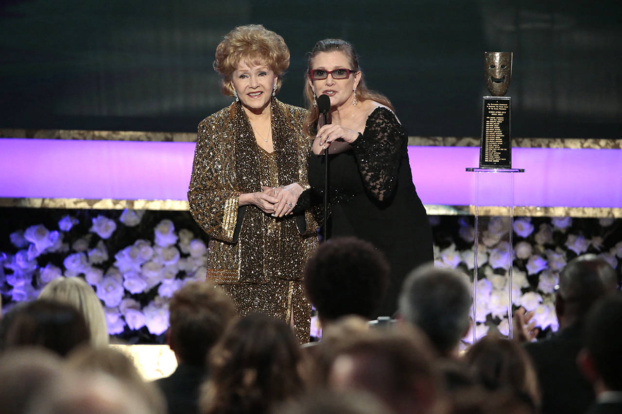 Carrie Fisher presents the Life Achievement Award to her mother, Debbie Reynolds, at the 2015 Screen Actors Guild Awards in Los Angeles. (Robert Gauthier/Los Angeles Times)