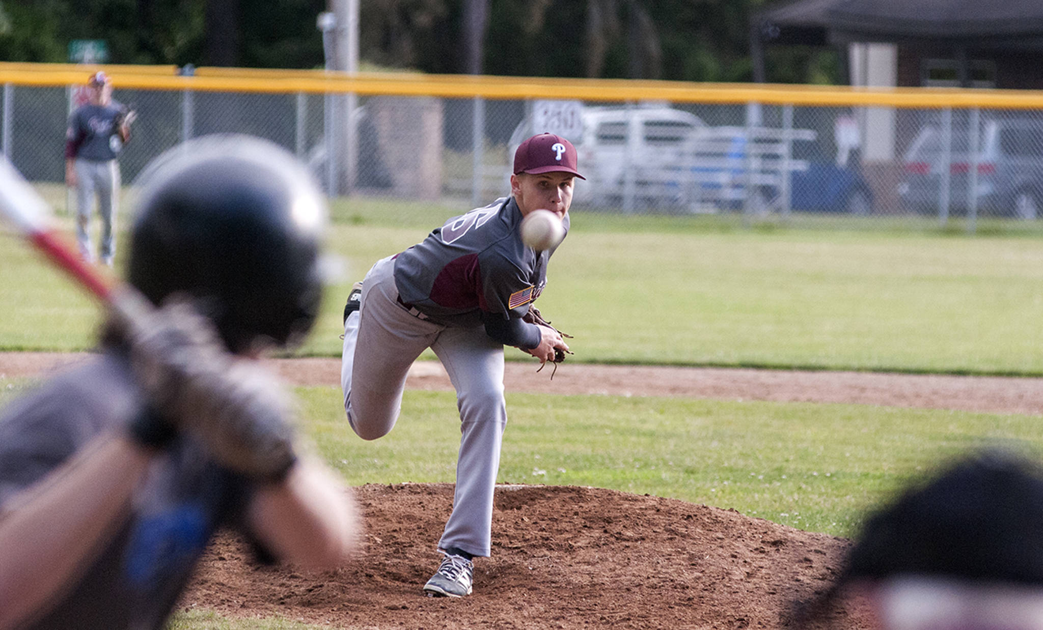 (Brendan Carl | The Daily World) Precision Pipe’s Drew Rose pitches against Elma Pharmacy on Tuesday. Rose allowed just two hits in the game and struck out nine in seven innings of work.
