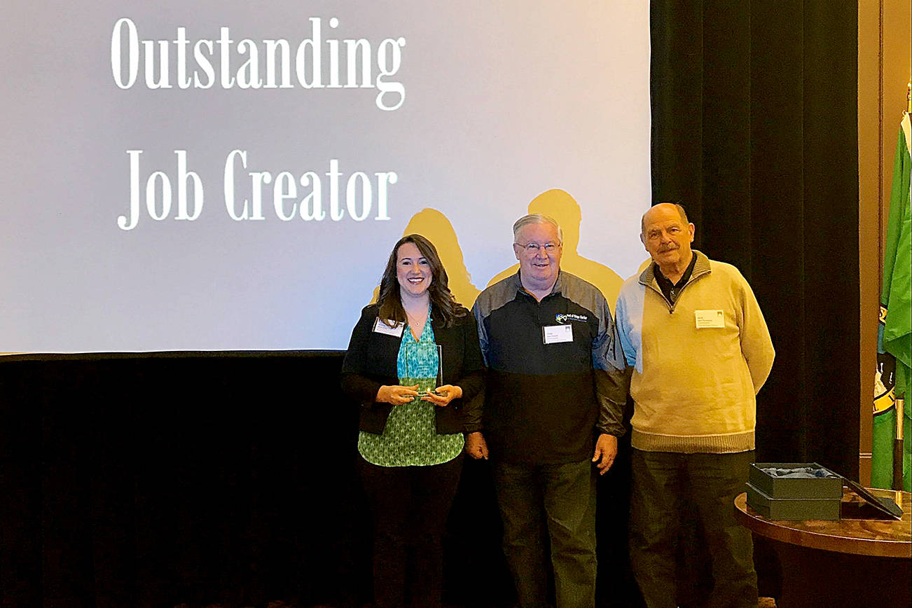 PORT OF GRAYS HARBOR PHOTO                                Satsop Business Park Manager of Business Development Alissa Shay, Port of Grays Harbor Commissioner Stan Pinnick and Port of Grays Harbor Commissioner Jack Thompson accept the Outstanding Job Creator award at Washington Public Ports Association awards breakfast earlier this month.