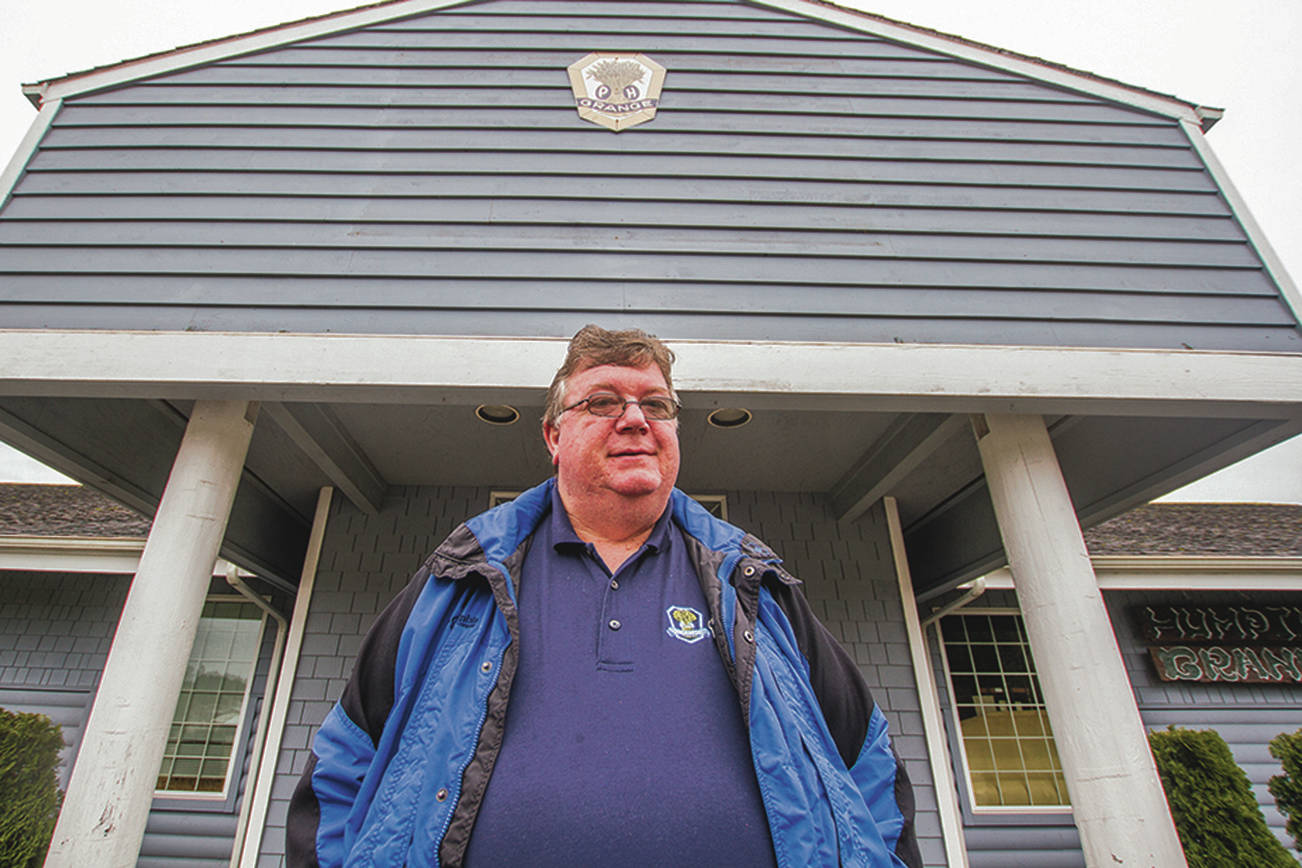(Kyle Mittan | The Daily World) Tom Gwin stands in front of the Humptulips Grange #730.