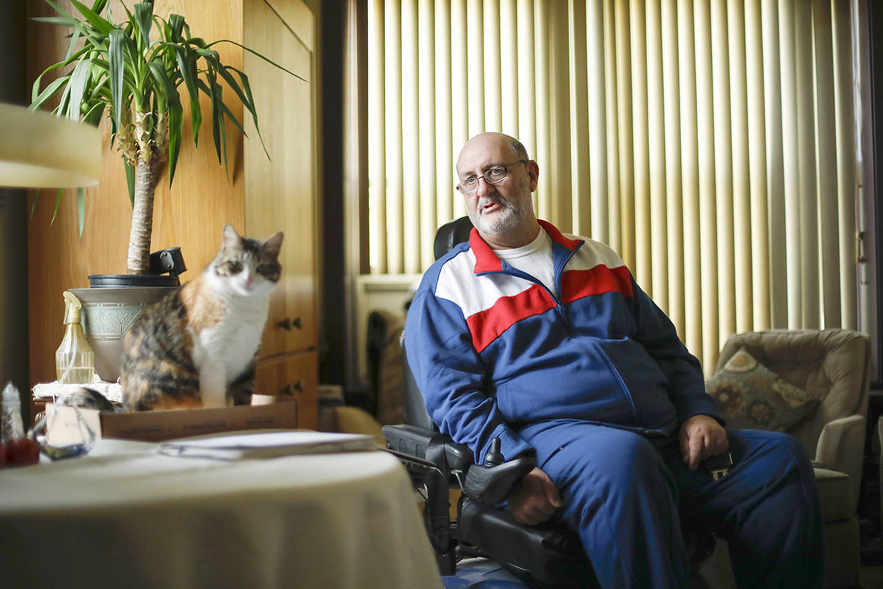 Jim Watkins, a longtime chronic pain patient who lives in Chicago, says he has been made to feel like a criminal in recent years because of his opioid pain prescription. (Jose M. Osorio/Chicago Tribune)
