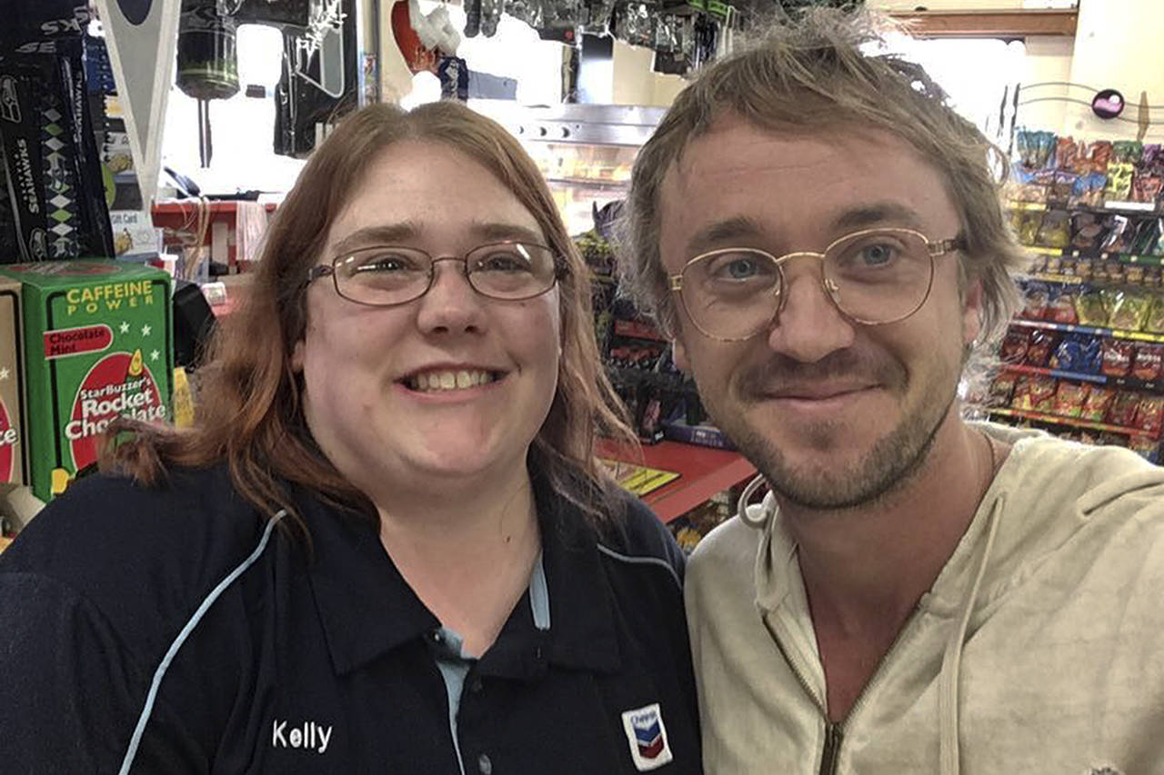 Actor Tom Felton posed for a selfie with cashier Kelly Carney on July 1 at the Maxi Mini Mart in Cosmopolis.