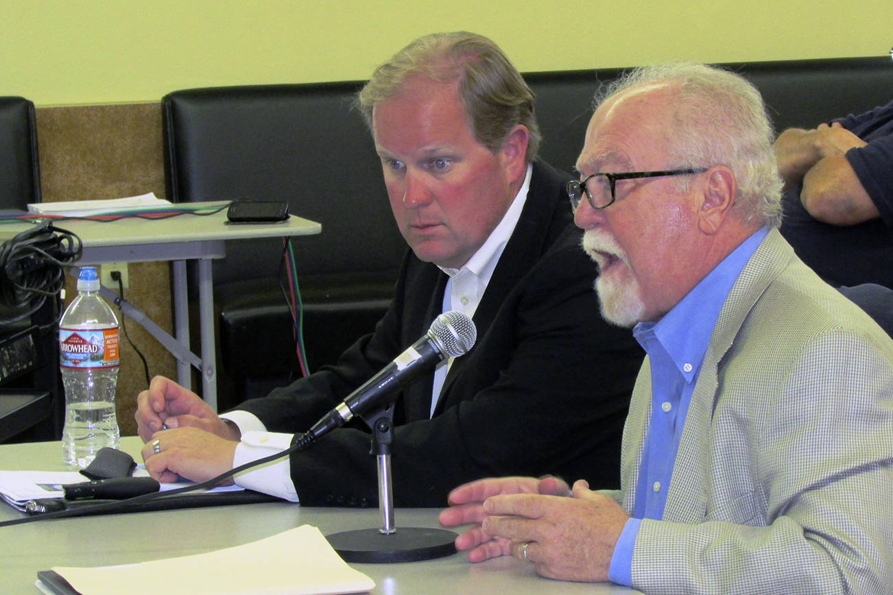 Two executives from Pinnacle Venue Services presented a detailed assessment of the Ocean Shores Convention Center at a study session of the Ocean Shores City Council held Monday at the Lions Club. Pictured are Managing Partner Douglas Higgons, left, and Senior VP Barry J. Strafacci, right. Photo by Scott D. Johnston.