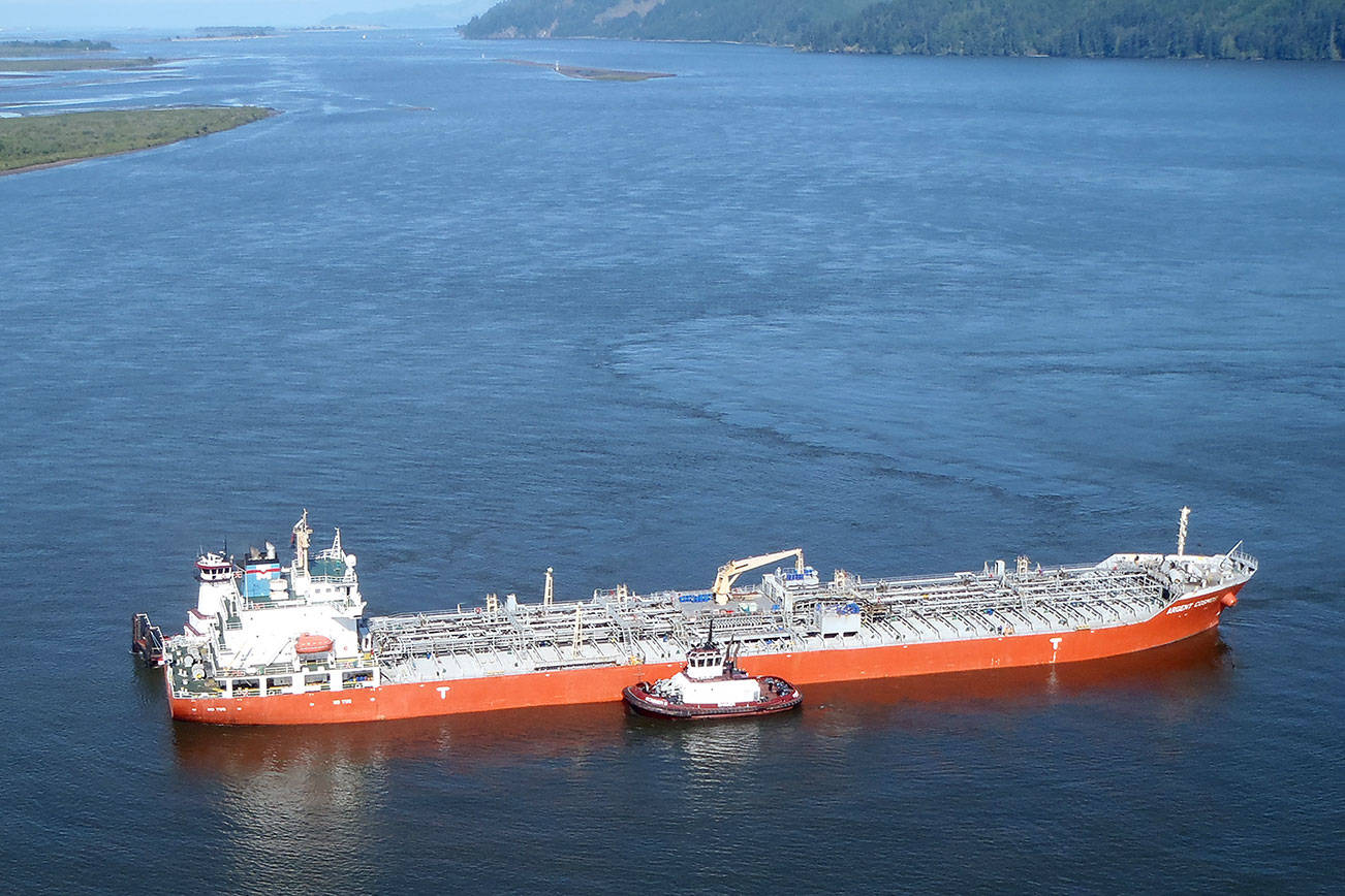 (U.S. Coast Guard photo by Petty Officer 1st Class Levi Read                                 The motor vessel Argent Cosmos, a 557-foot Panamanian-flagged tanker, sits aground in the Columbia River near Skamokawa on Thursday. The Coast Guard teamed with local agencies to free the vessel around 2:30 p.m. Thursday.