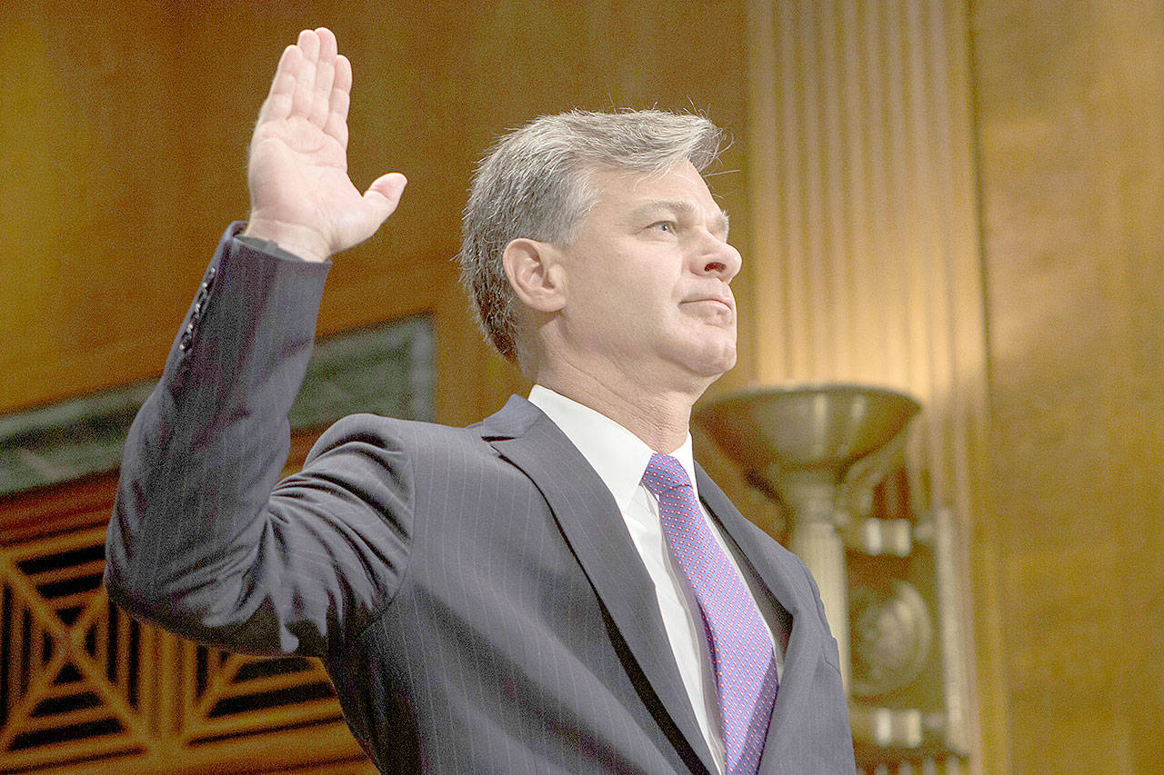 Alex Edelman/TNS                                Christopher Wray is sworn in by the Senate Judiciary Committee prior to his confirmation hearing to be FBI Director on July 12.