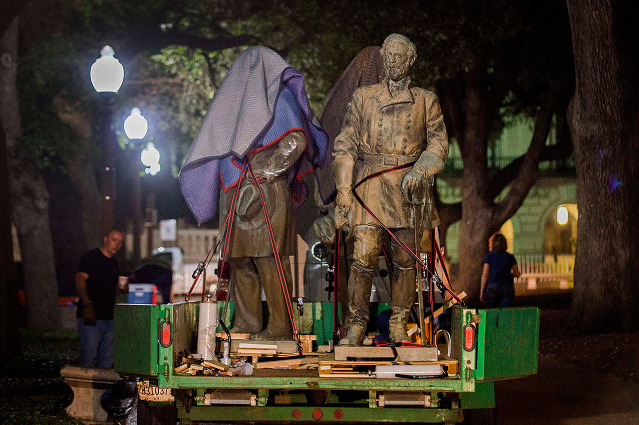The statues depicting Robert E. Lee, Albert Sidney Johnston, John Reagan and James Stephen Hogg were removed from the Main Mall at The University of Texas at Austin on Sun. and Mon. (Aug. 20-21, 2017). The Lee, Johnston and Reagan statues will be added to the collection of the Briscoe Center for scholarly study. The statues of James Hogg, governor of Texas (1892-1895) will be considered for re-installation at another campus site. Shown is the Robert E. Lee statue after it was removed from its pedestal. (University of Texas at Austin)