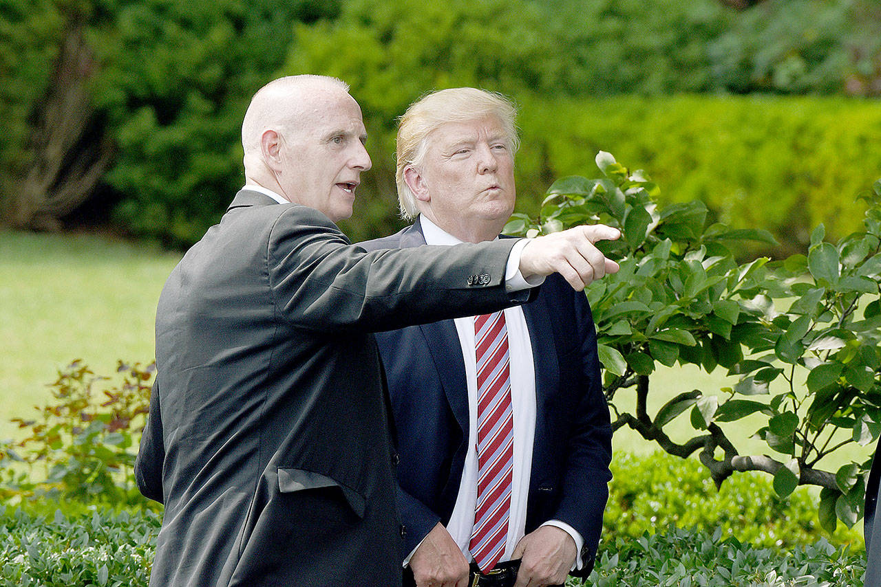 Keith Schiller, deputy assistant to the president and director of Oval Office operations, talks to President Donald Trump during a ceremony on the South Lawn of the White House in Washington, D.C., on June 12. (Olivier Douliery/TNS)